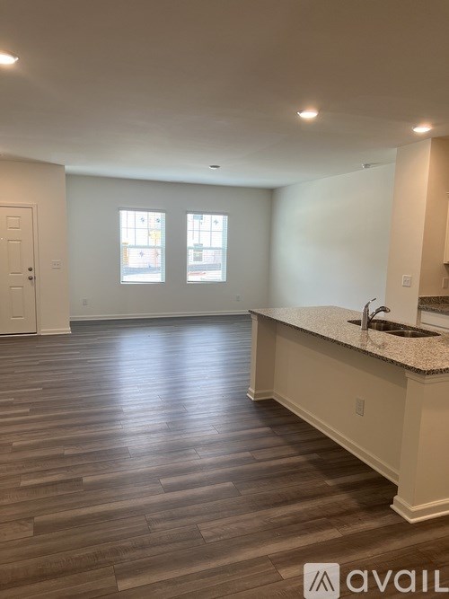 A kitchen with a countertop and a sink.