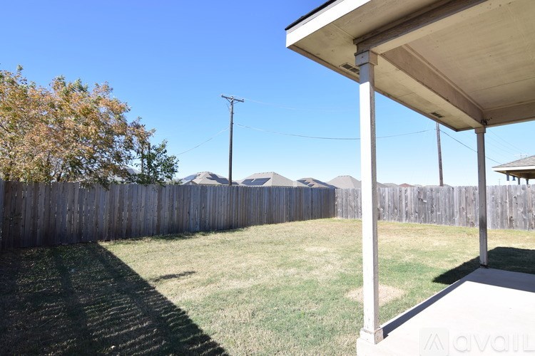 A bathroom with a toilet, sink, and mirror.