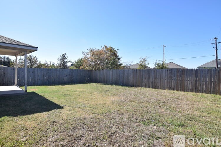 A bathroom with a tub, sink, and shower.