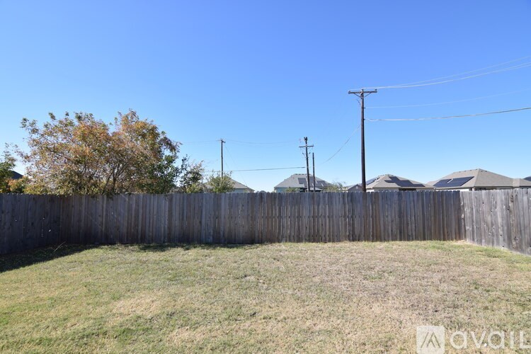 A bathroom with a toilet, sink and bathtub.