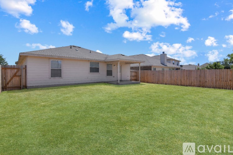 A house with a fence and a front yard.