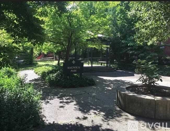A sign in a park that says Magnolia Park.