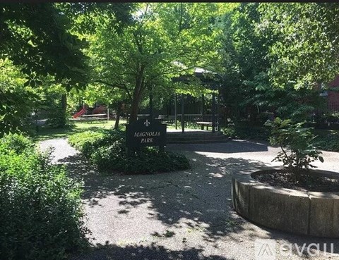 A sign in a park that says Magnolia Park.