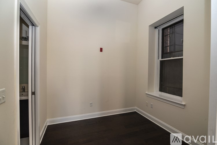 A room with a window and a door.