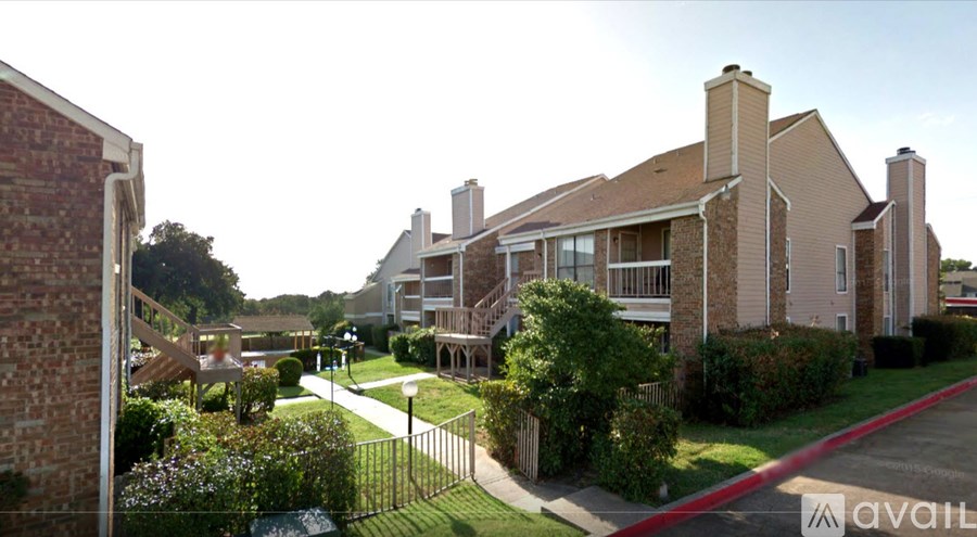 A residential area with houses and a street.