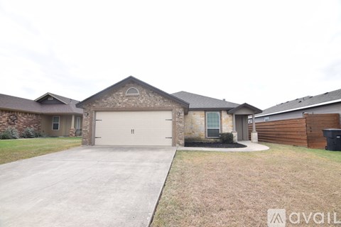 A house with a garage is available for sale.