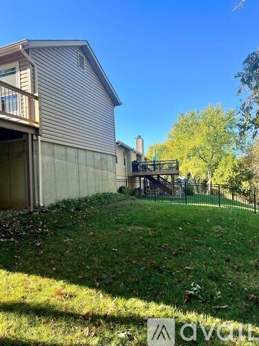 A house with a backyard and a deck.