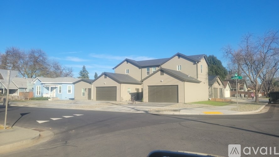 A row of houses with a blue house on the left.