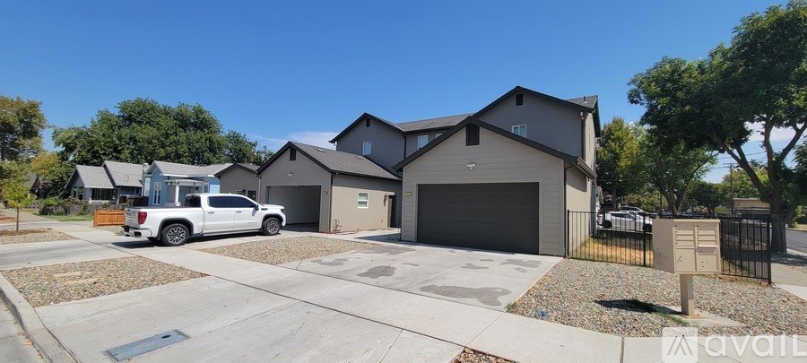 A house with a garage and a driveway is for sale.