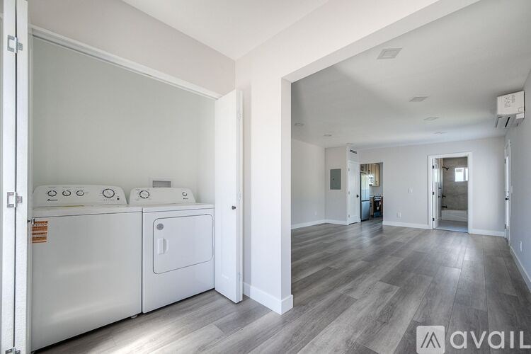 A laundry room with a washer and dryer.