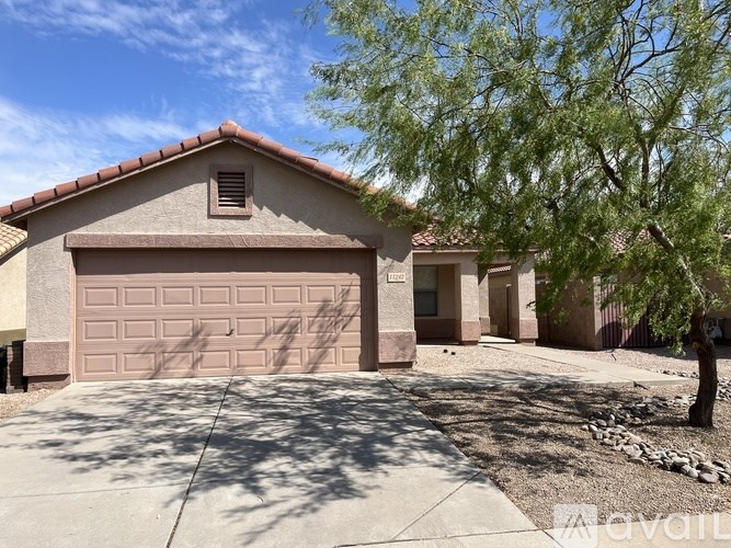 A house with a brown garage door is for sale.