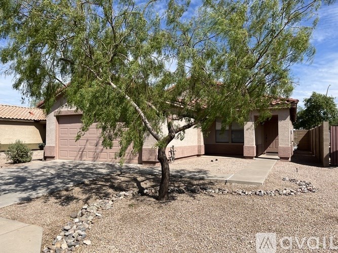 A house with a tree in front of it.