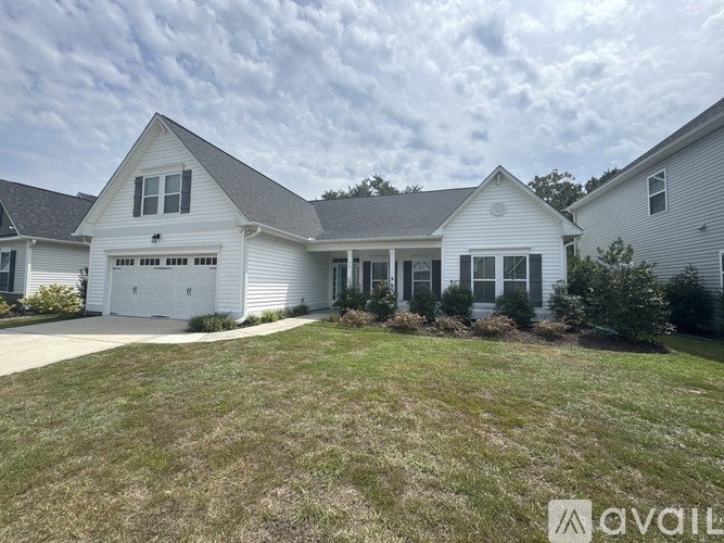 A house with a garage is available for sale.