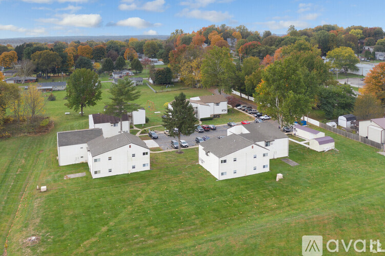 A bird's eye view of a residential area with houses and trees.