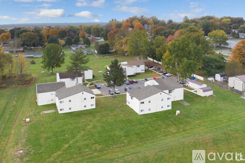 A bird's eye view of a residential area with houses and trees.