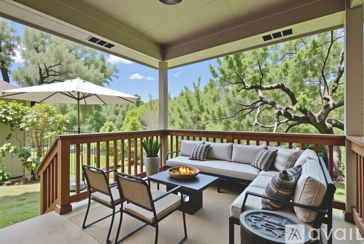A patio with a table and chairs and a couch.