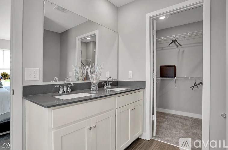 A modern bathroom with a double sink vanity.