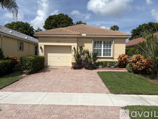 A house with a driveway in front of it.