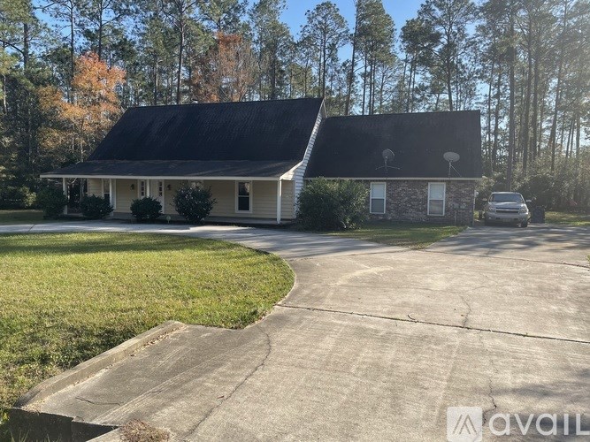 A house with a driveway in front of it.