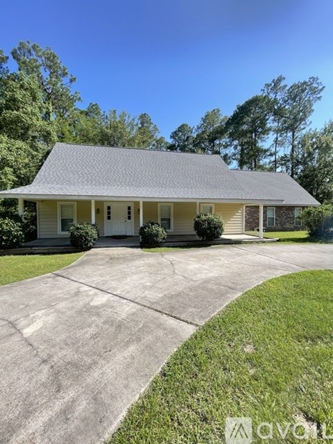 A house with a driveway in front of it.