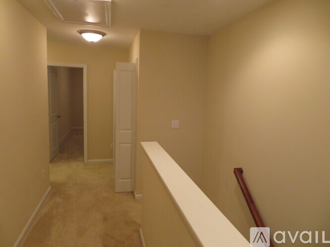 A long hallway with a door at the end.