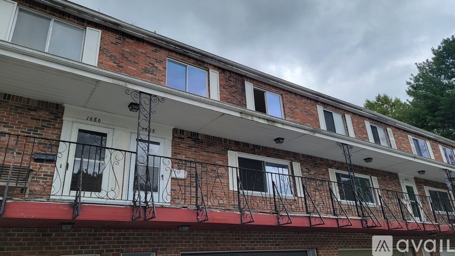 A building with a sign that says "available" on the side.