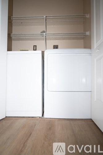 A wooden deck with a white fence and a rope tied to the fence.