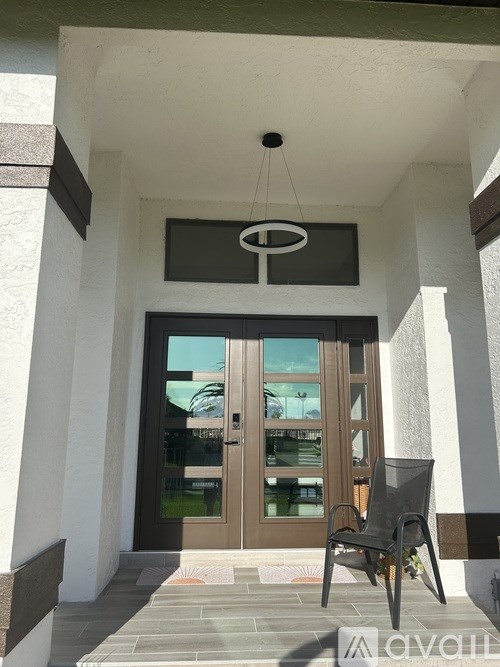 A chair is placed in front of a door.