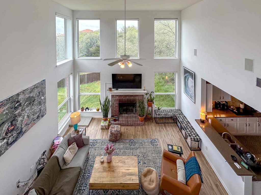 A living room with a fireplace and a couch.