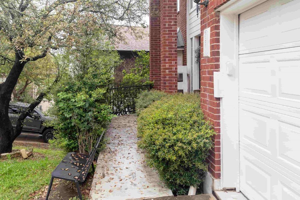 A white garage door is on the right side of the image.