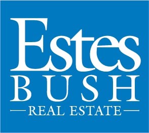 A blue sign with the words "Estes Bush Real Estate" in white.