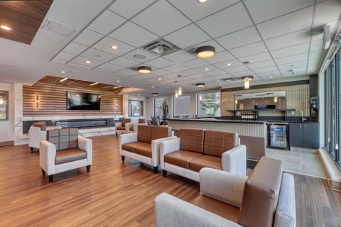 A spacious waiting area with brown and white furniture.