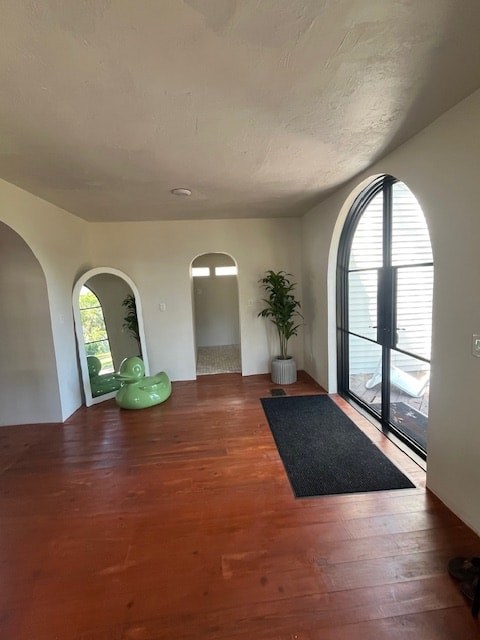 A room with a wooden floor and white walls.