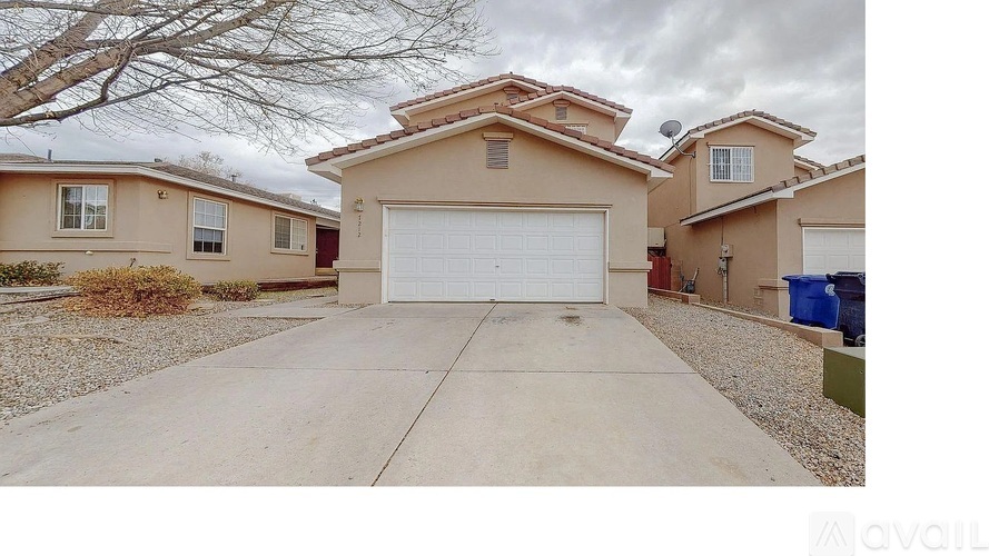 A house with a white garage door in the front.