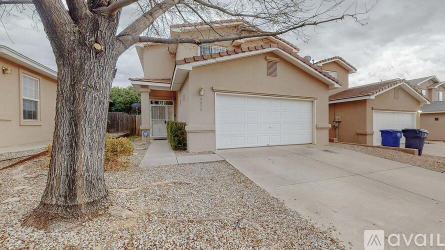 A house with a tree in front of it is for sale.