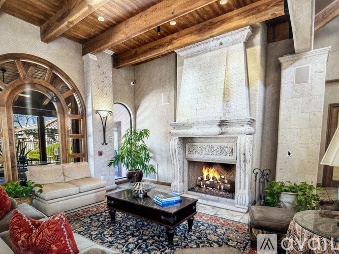 A living room with a fireplace and a couch.