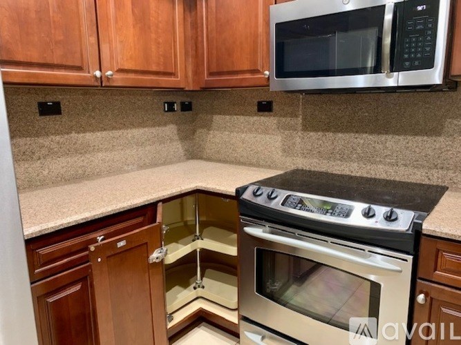 A kitchen with a stove top oven and microwave above it.