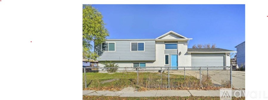 A house with a blue door is for sale.
