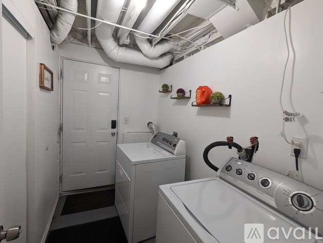 A laundry room with a washer and dryer.