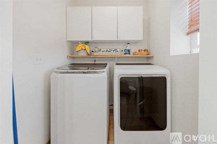 A white oven and microwave in a kitchen.