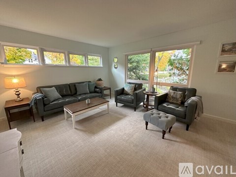 A living room with grey couches and a coffee table.
