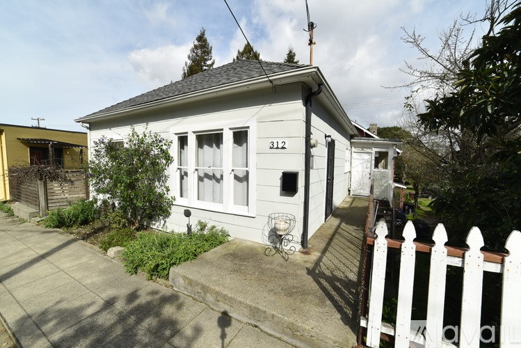 A white house with the number 312 on it.