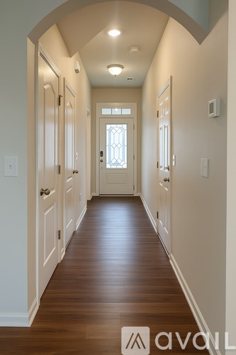 A bathroom with a toilet, sink, and shower.