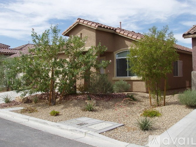 A house with a brown roof and a brown wall with a window and a door.
