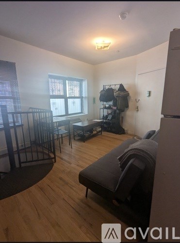 A living room with a couch, chair, and a table.