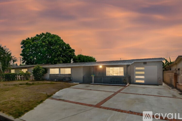 A house with a driveway in front of it.