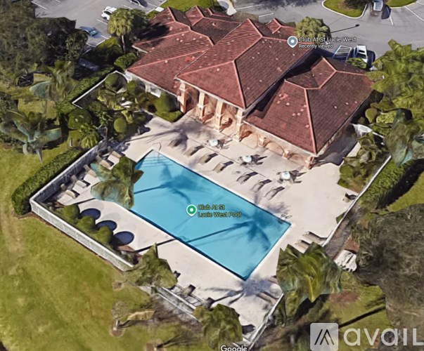 An aerial view of a house with a pool and a label "Club 80".