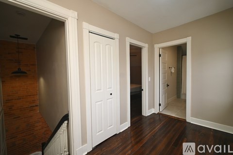 A bedroom with a large bed and a white bedspread.