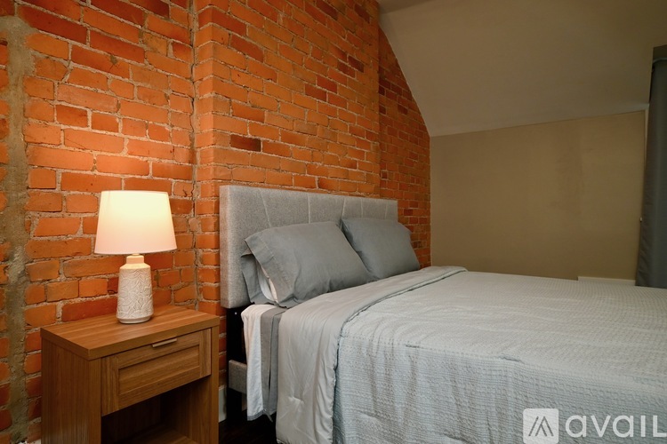 A spacious walk-in closet with white shelving and a window.
