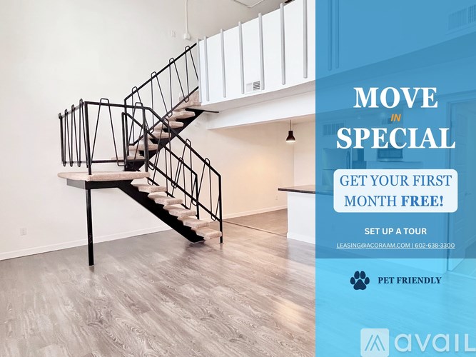 A staircase in a room with a sign offering a free first month for a tour.